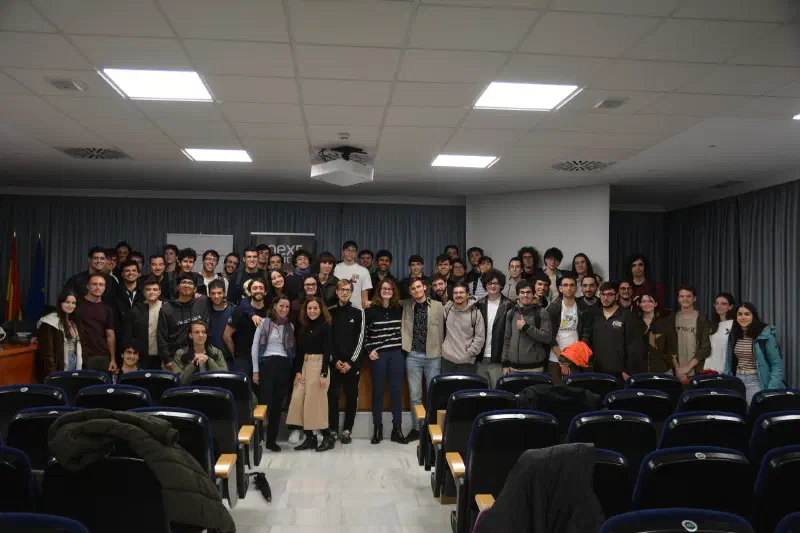 Group photo of Algorithmics Club members and contestants in a university lecture hall